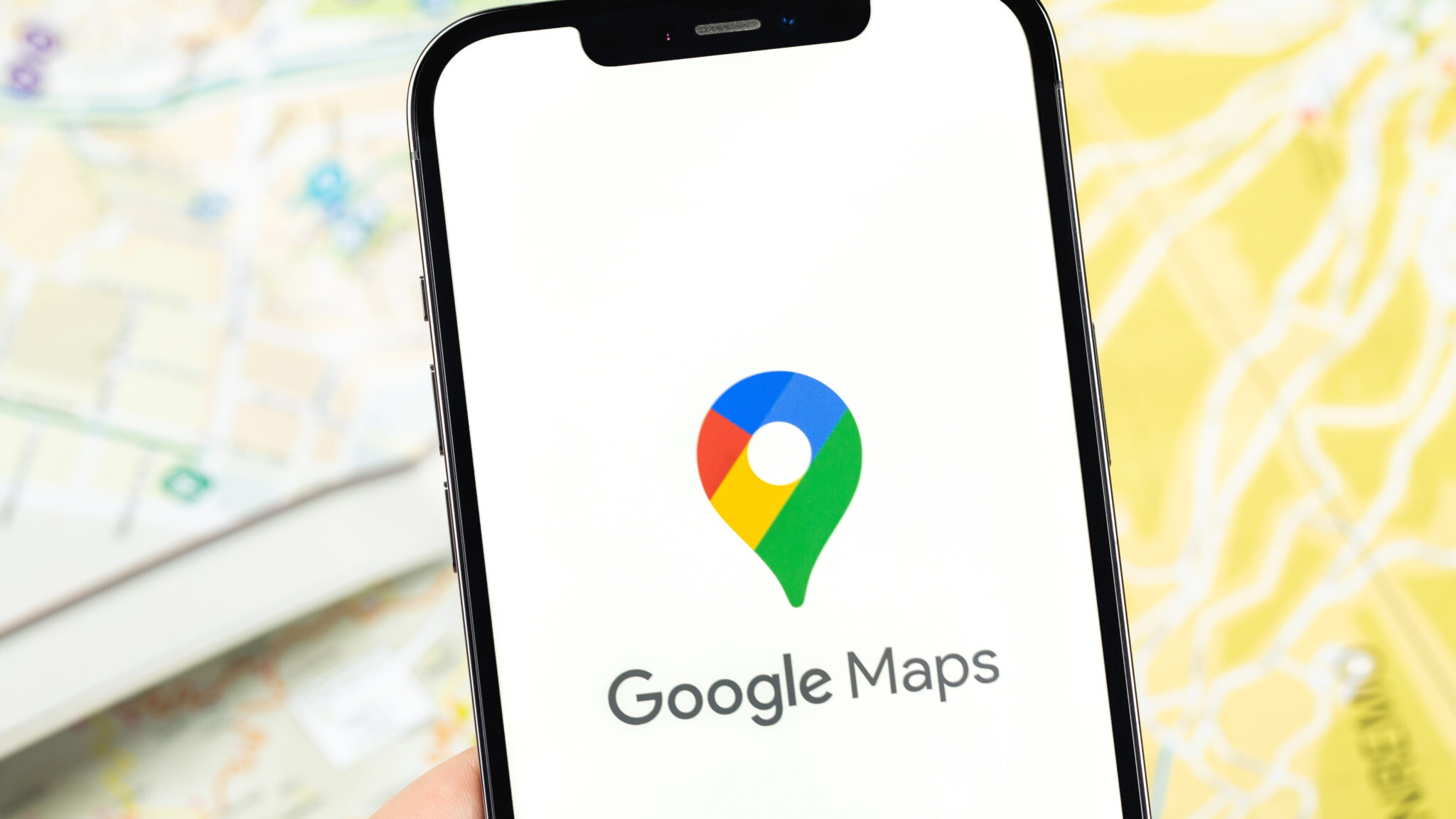 Business owner opening google maps in their phone