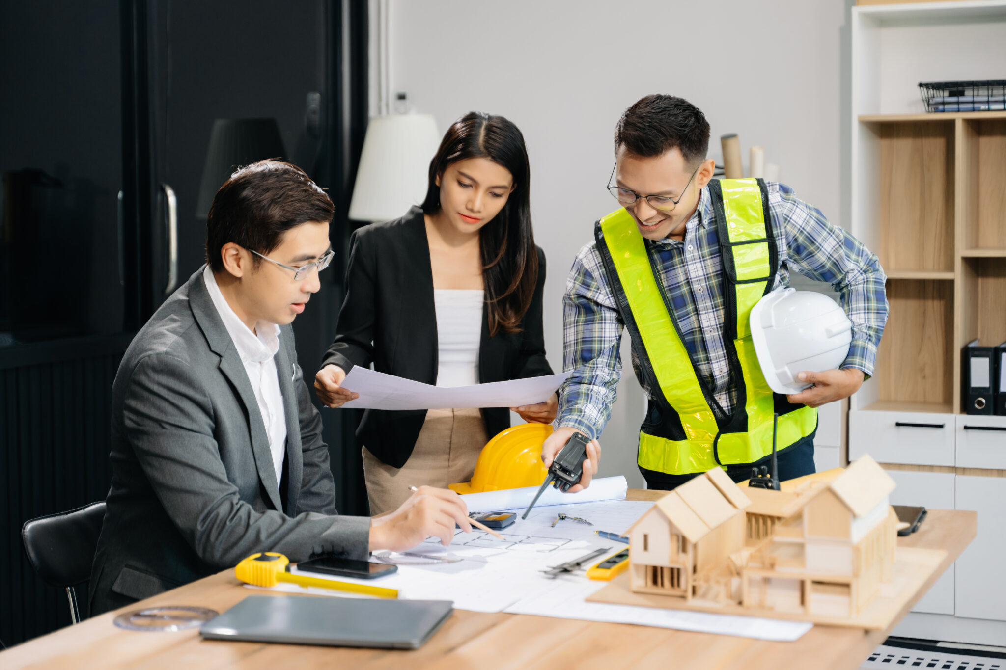 Team of engineers collaborating with other businesses to lead generation strategies for general contractors