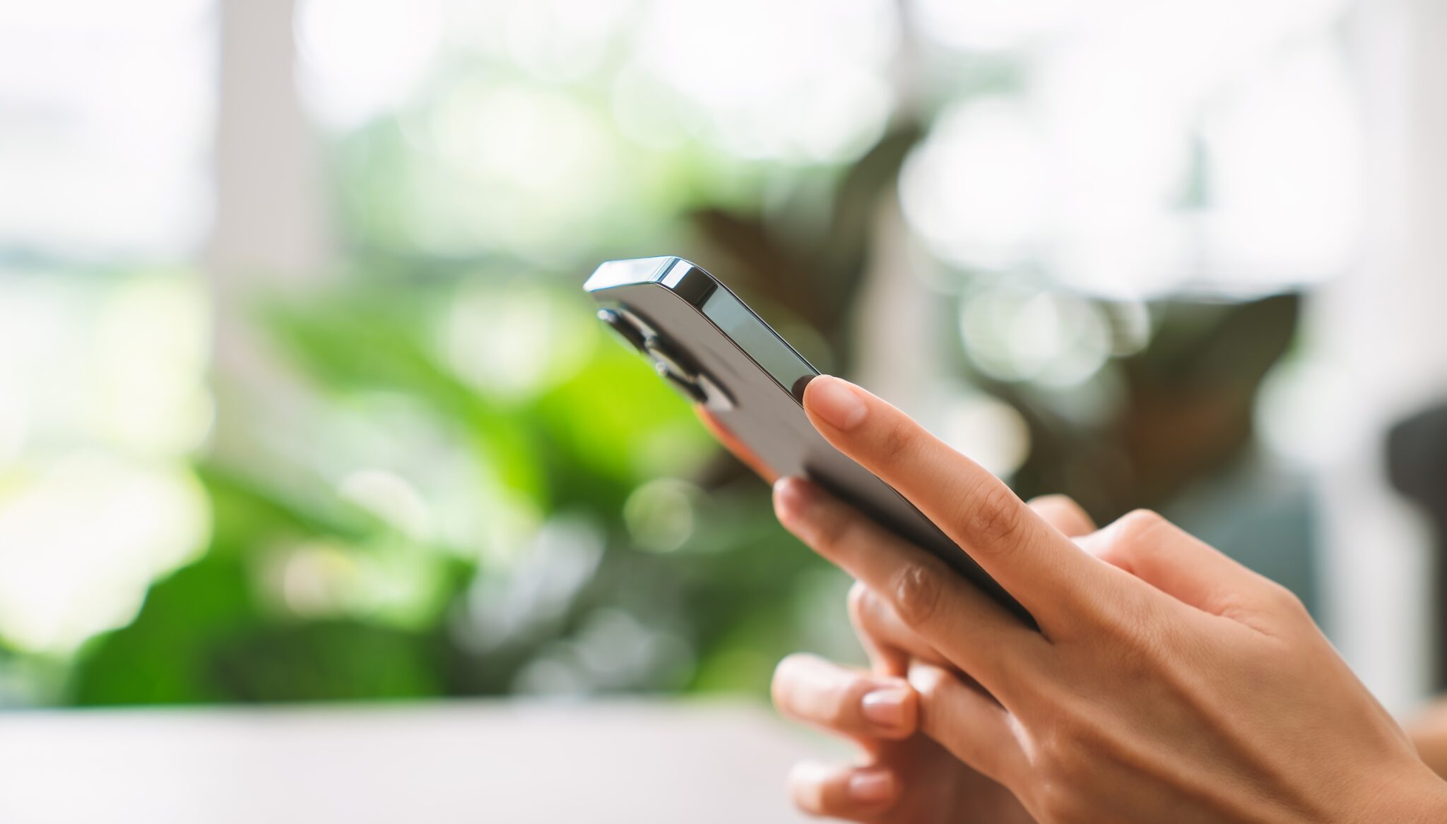 Hand holding a smartphone, showing Google’s Map Pack for local businesses