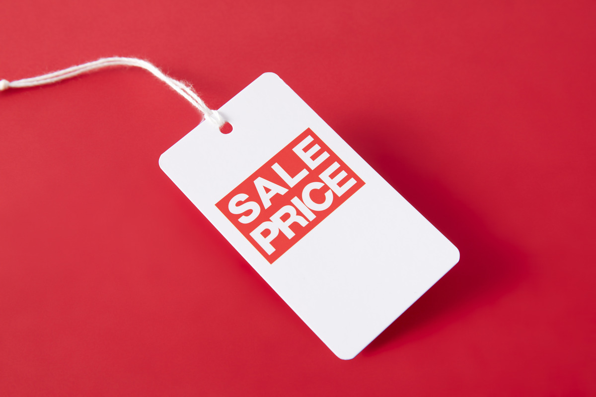 Sale price tag prominently displayed against a vibrant red background, emphasizing discounts and promotional offers