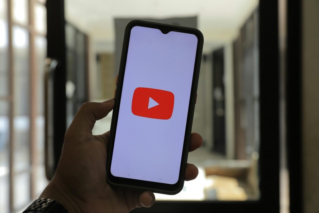 A showing YouTube logo on a mobile phone