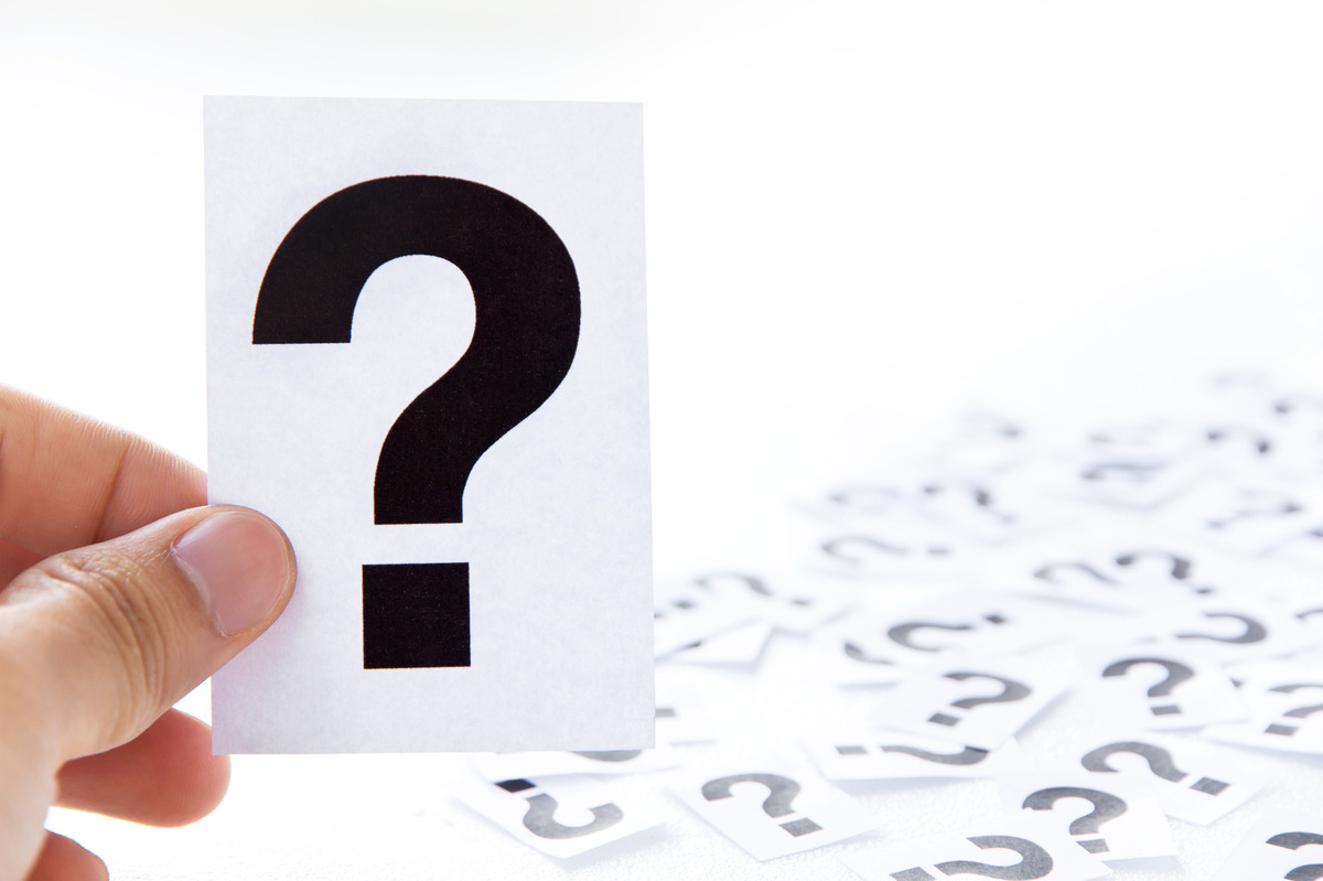 Black question mark symbol on a digital background