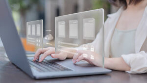 floating graphics of data exchange on top of the woman's laptop