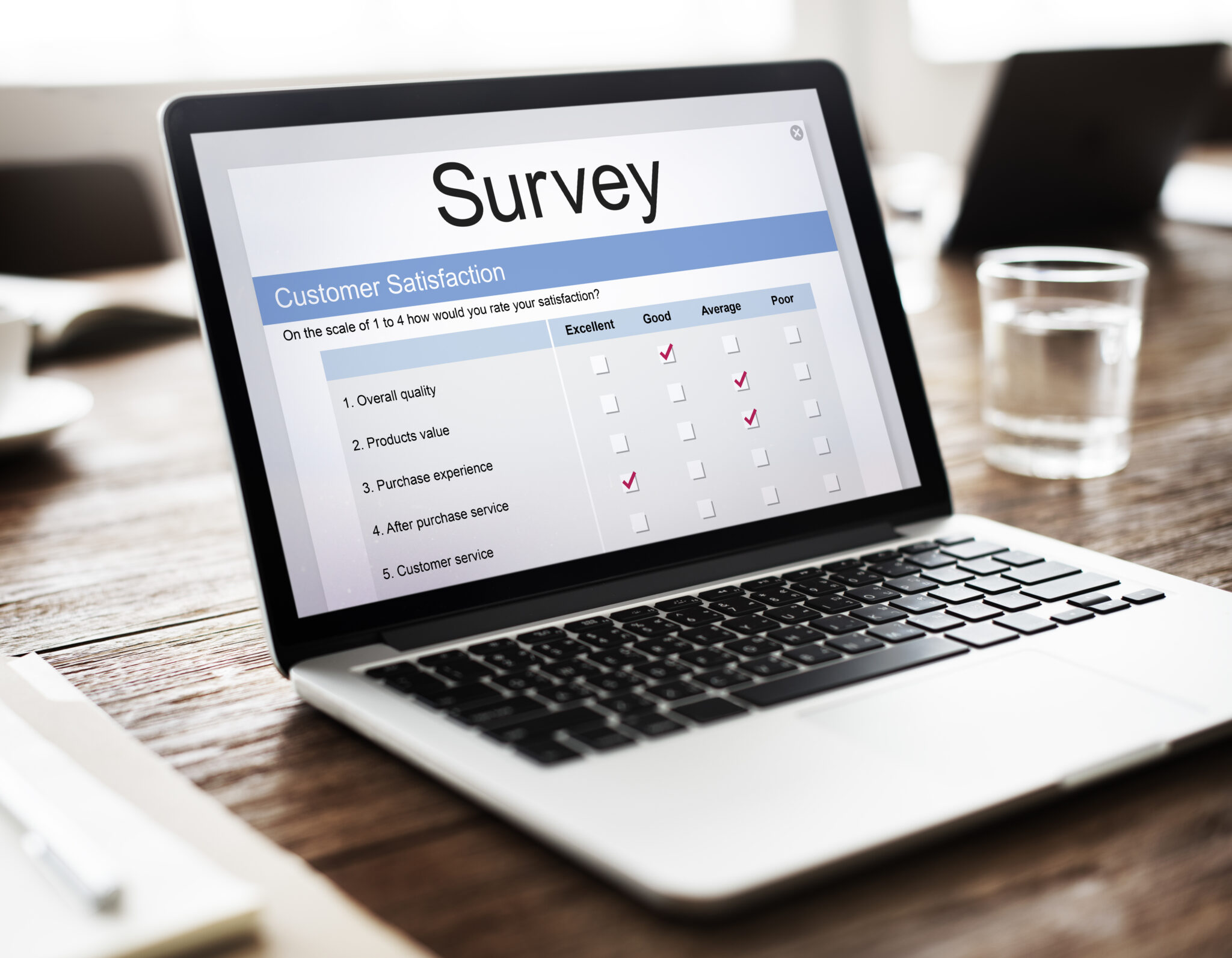 Customer feedback and market research survey being filled out, used for improving customer service and business quality