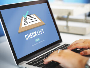 Digital checklist for task management and productivity showing a clipboard icon on a laptop screen, representing efficient business workflows and project organization