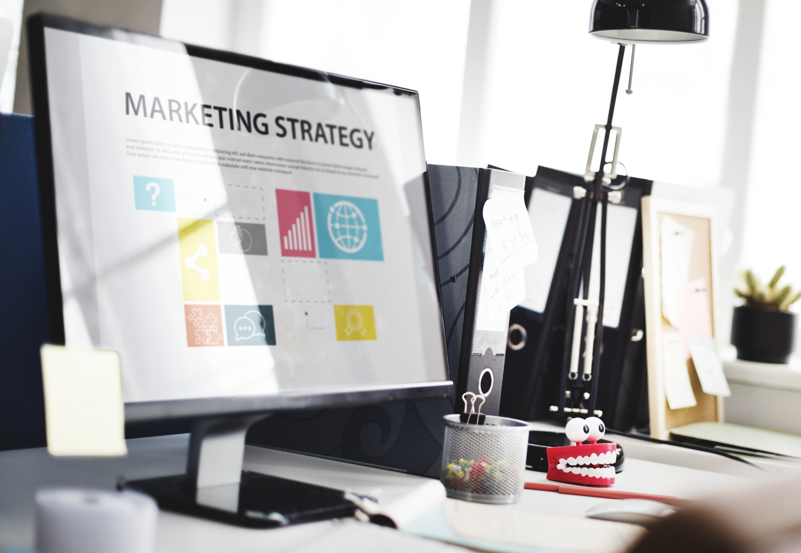 A digital marketing strategy plan shown on a desktop screen, highlighting key business growth pillars such as data visualization, networking, and creative planning for search engine visibility and brand development