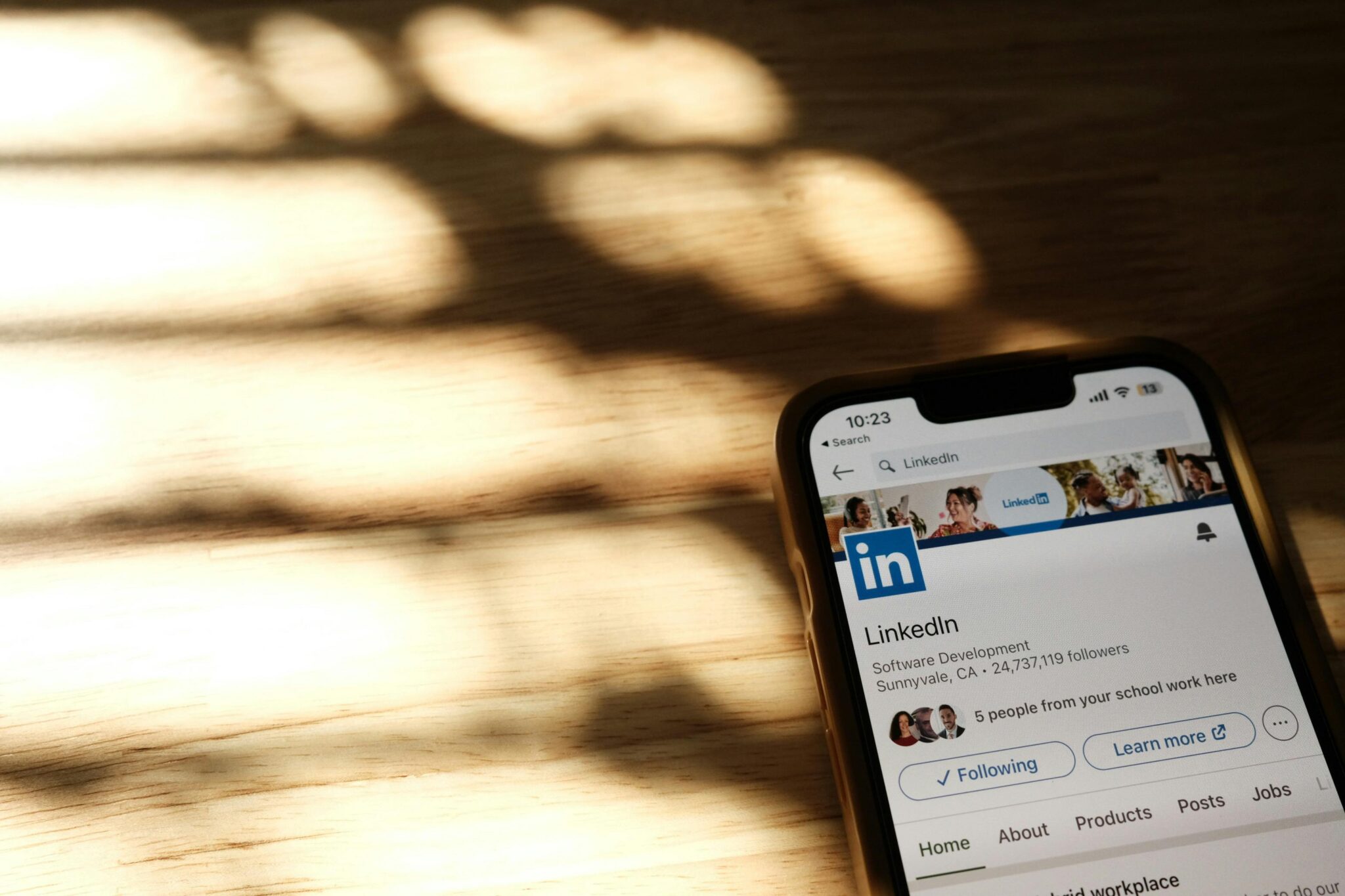 Smartphone displaying LinkedIn app, highlighting its use for professional networking and B2B marketing