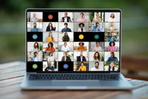 Laptop screen displaying a virtual meeting with multiple participants, discussing strategies for crafting an authentic digital voice