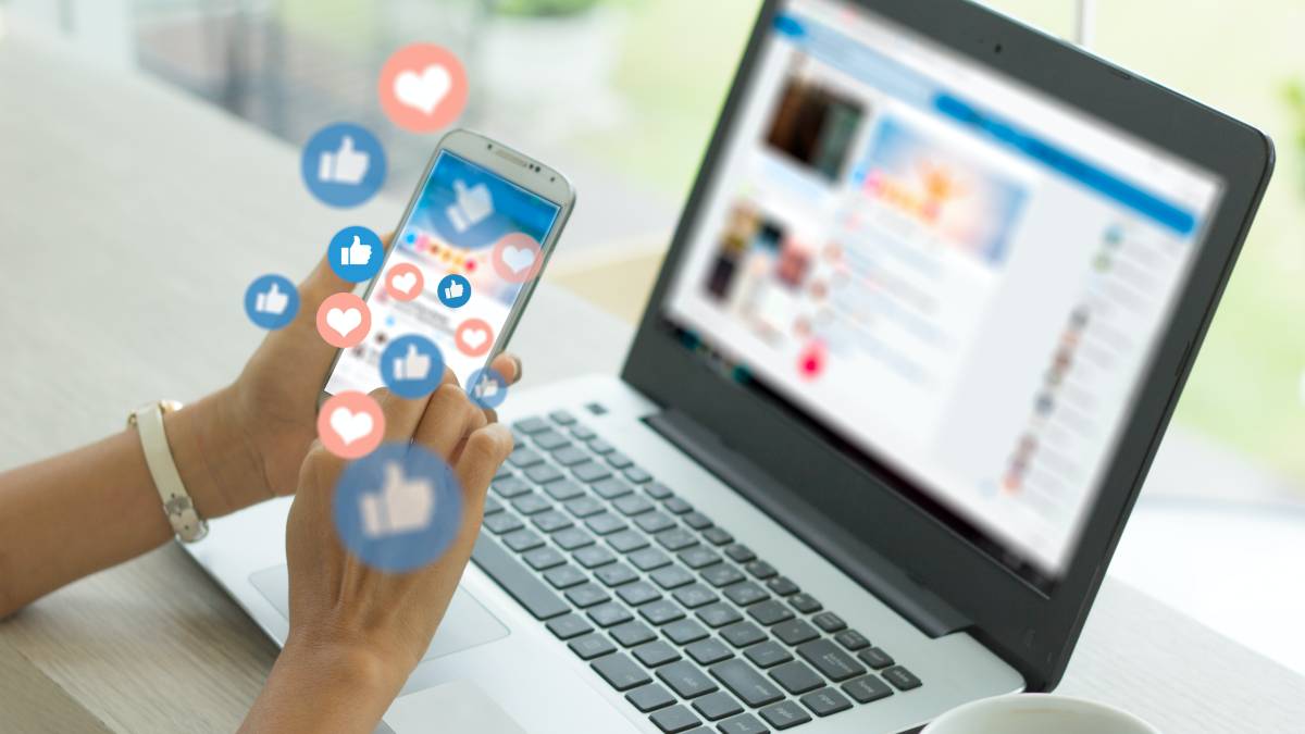 A photo showcasing social media platforms with reaction icons, representing strategies for general contractors to generate leads through social media advertising