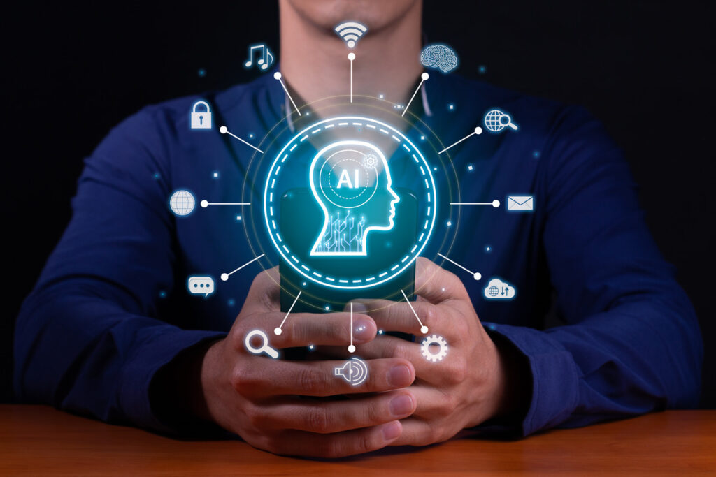 A man holds a smartphone displaying icons representing AI brain concepts, symbolizing AI's role in content creation