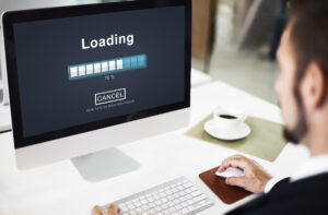 Loading page on a computer screen, illustrating the process of changing a website URL completely