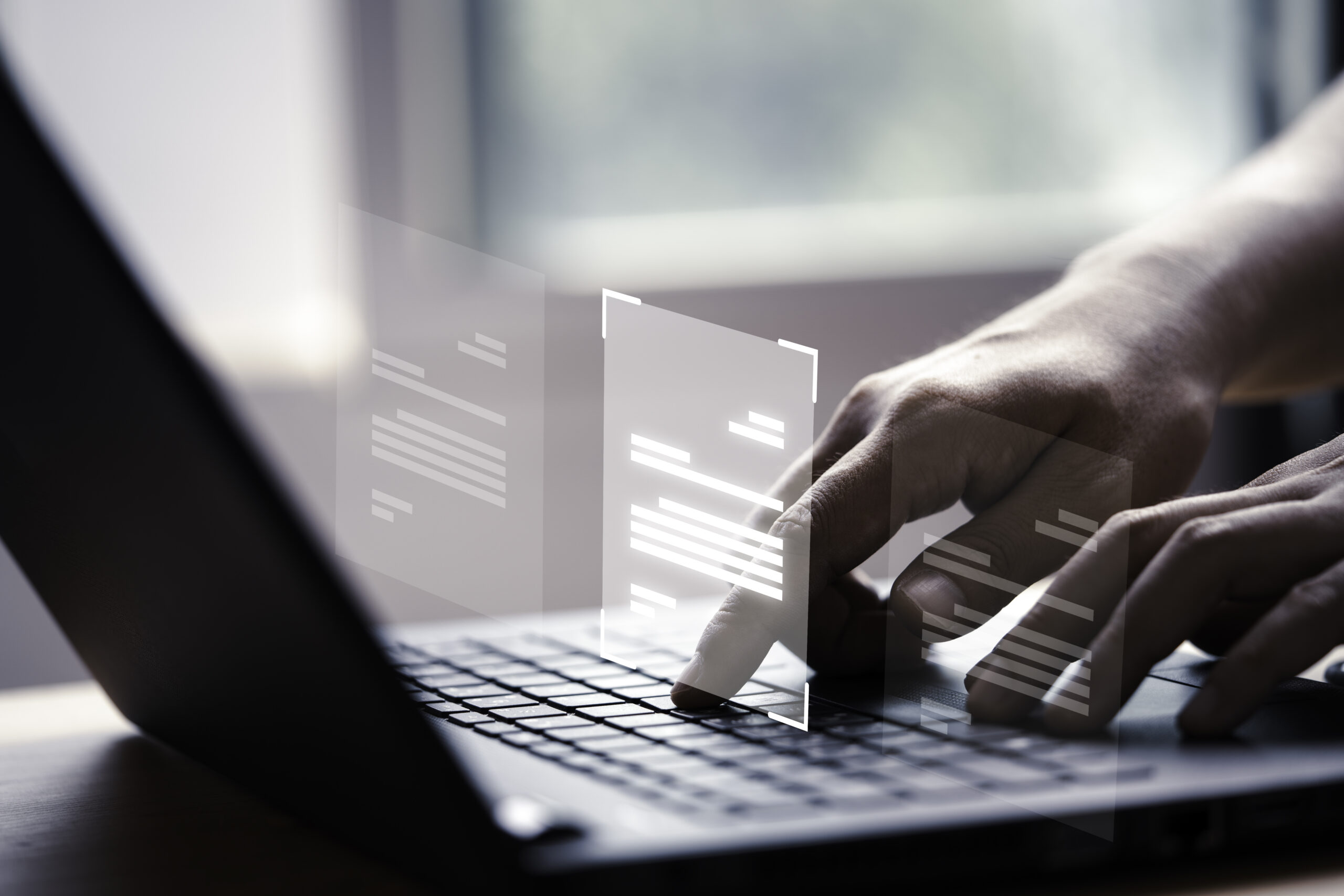 Hand using laptop computer with virtual screen and document for Man using AI for marketing