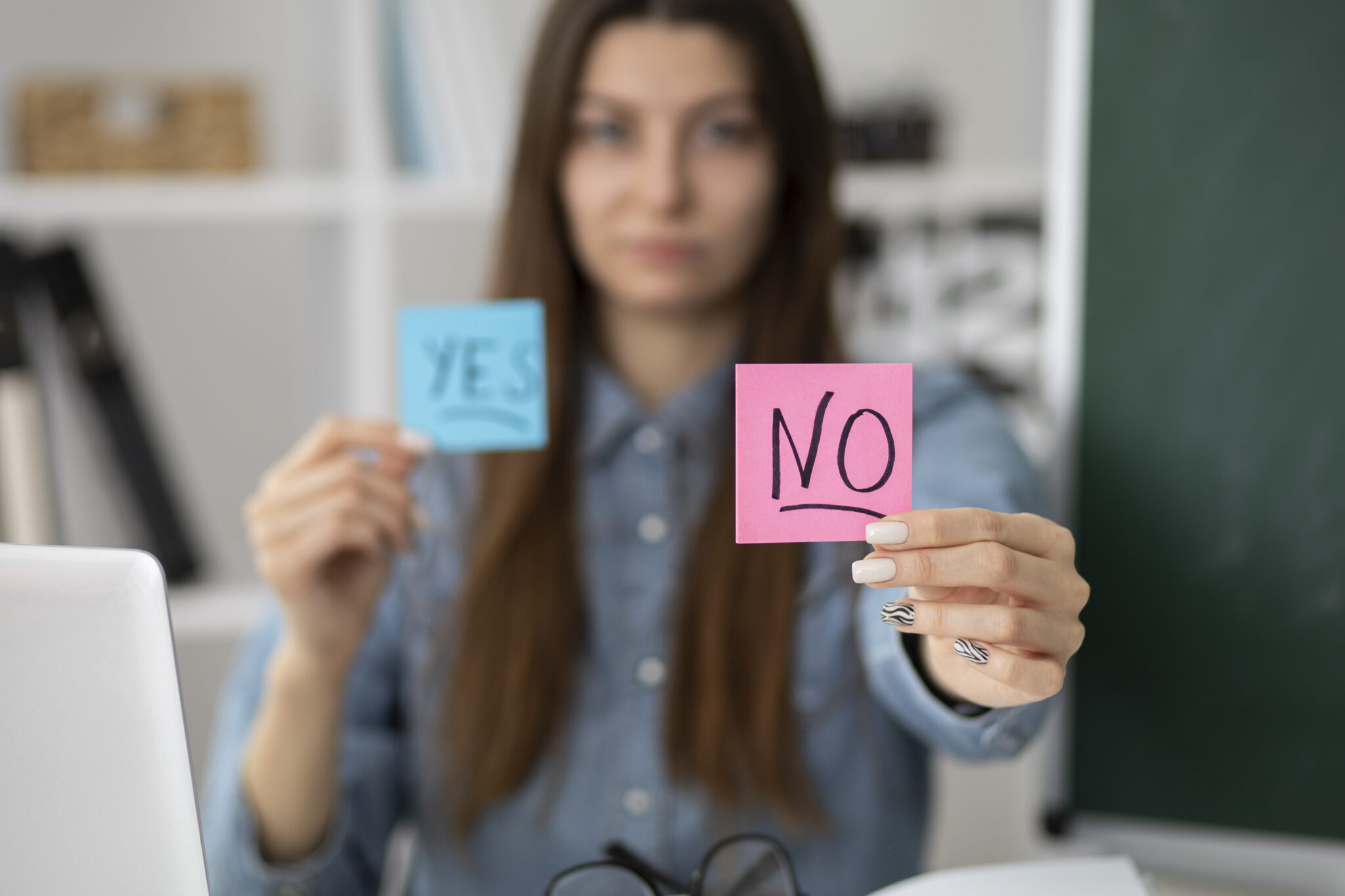 Woman holding a NO post it