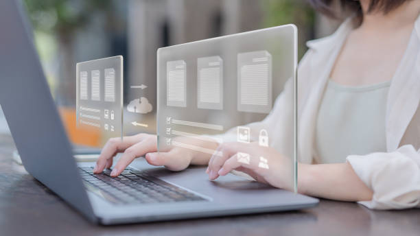 floating graphics of data exchange on top of the woman's laptop