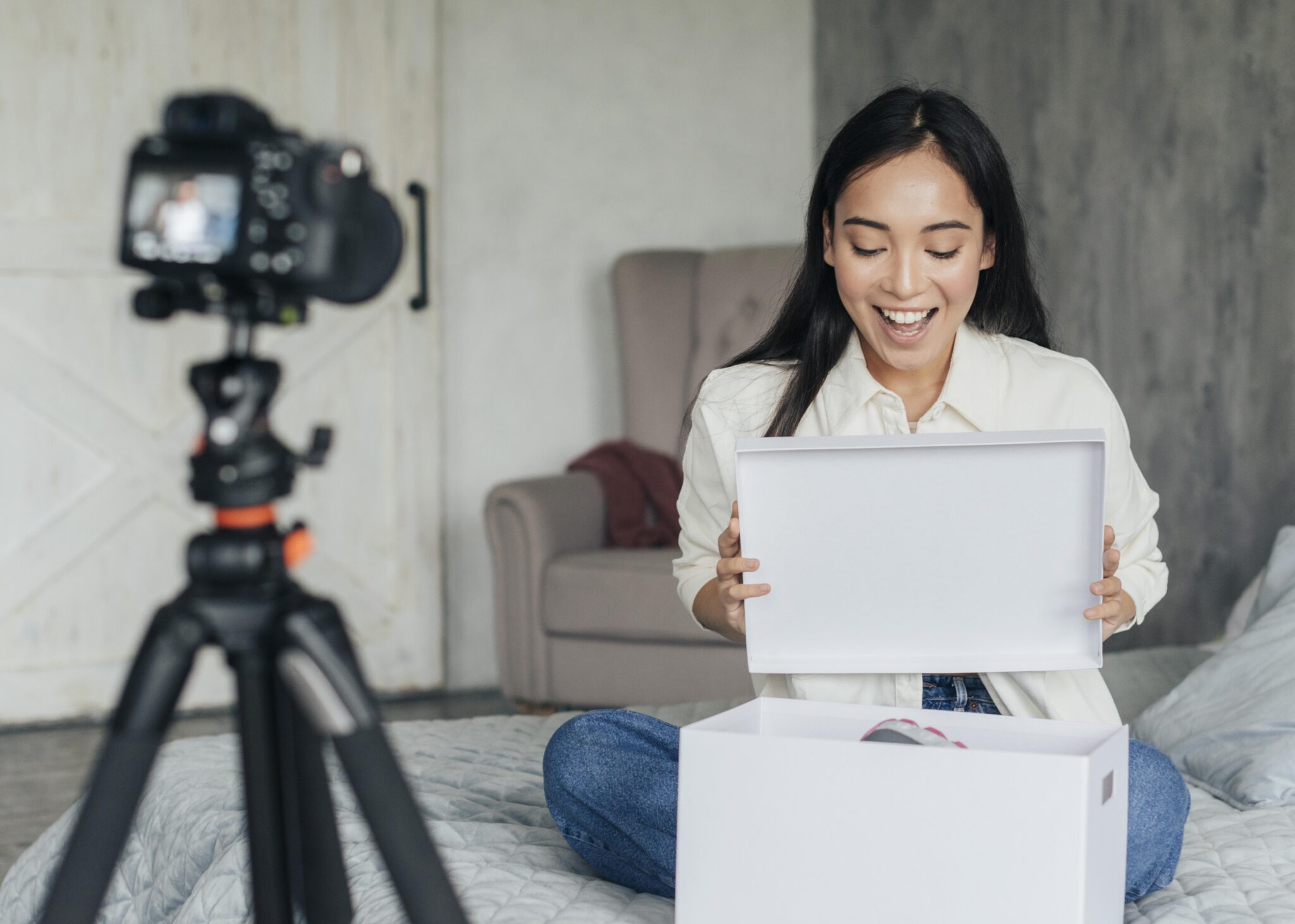 Creator making content for a product review or haul video, illustrating the customer experience of receiving and unboxing an e-commerce order
