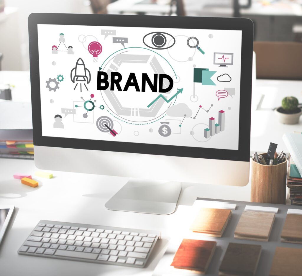 Professional branding and identity design concept shown on a computer screen, illustrating core business strategies like brand growth, market analysis, and creative development