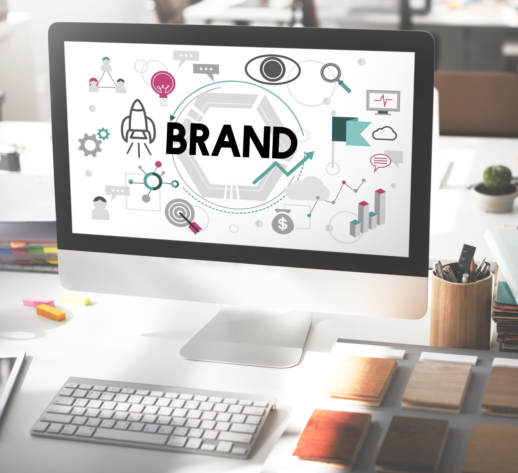 Professional branding and identity design concept shown on a computer screen, illustrating core business strategies like brand growth, market analysis, and creative development