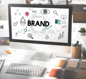 Professional branding and identity design concept shown on a computer screen, illustrating core business strategies like brand growth, market analysis, and creative development