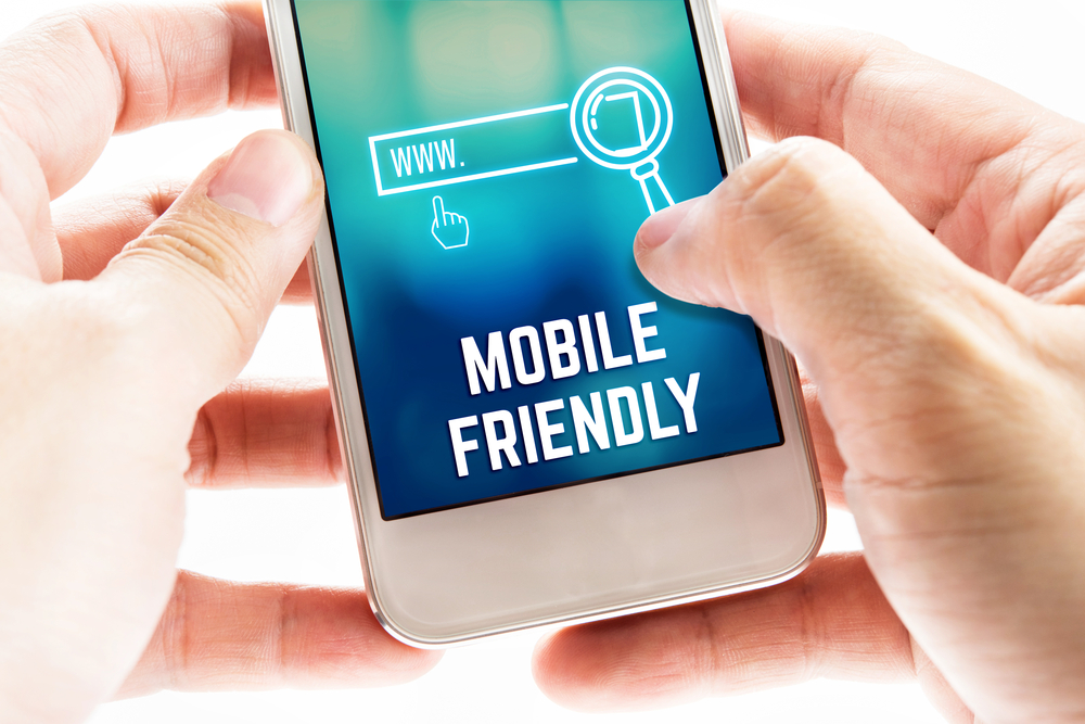 Person using a smartphone displaying a mobile-friendly website interface, representing mobile SEO, responsive web design, mobile search optimization, and improved user experience across devices.