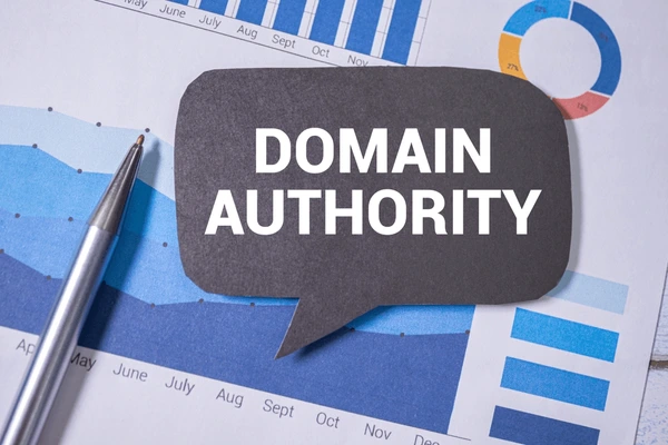 Domain authority concept displayed over website analytics charts, representing website credibility, SEO performance, backlink quality, search engine rankings, and strategies for improving domain authority and organic visibility.