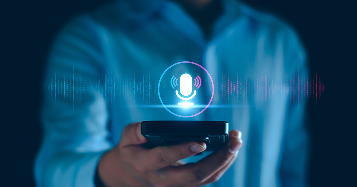 Person using voice search on a smartphone with a microphone icon and sound waves, representing voice search SEO, mobile search optimization, conversational keywords, local search, and digital marketing.
